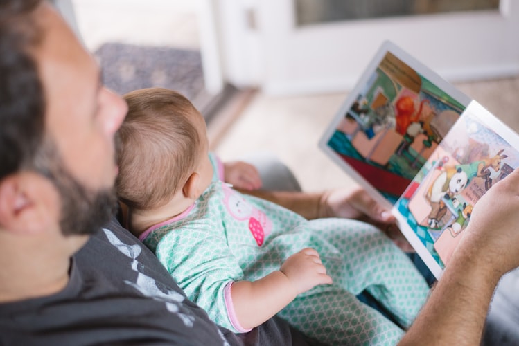 Reading is one way how to teach your baby communication skills.